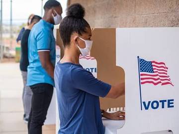 woman at voting booth